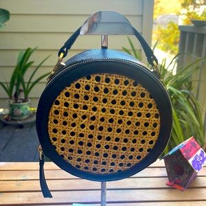 Vince Camuto round crossbody, rattan and blk leather.